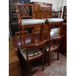 A 4' 7 1/4" reproduction yew drop-leaf dining table with gated action, central standard supports and