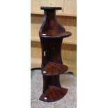 A 20th Century stained wood wall mounted three shelf corner display stand