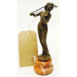 A small bronze figure of a violinist set on red marbled socle