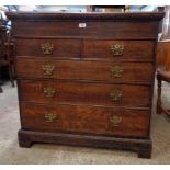 A 3' 1 1/2" Georgian stained oak chest of two short and three long graduated drawers, set on