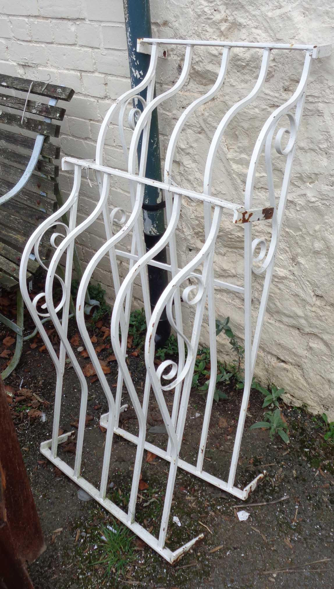 Two similar wall mounted painted wrought iron window railings, one 3' 9 1/4" X 21", the other 35 1/