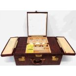 A mid 20th Century American crocodile effect leather clad vanity case with mirror set fold-out