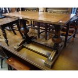 A 36" 20th Century polished oak refectory style side table, set on massive bulbous standard ends and