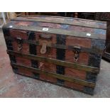 A 30" late 19th Century American dome topped travelling trunk with iron bound lath top and paper