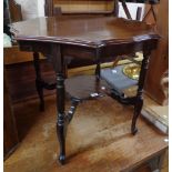 A 29" Edwardian walnut two-tier occasional table with turned and reeded supports