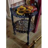 A small two-tier cast metal table - sold with a door stop