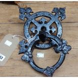 A cast iron door knocker