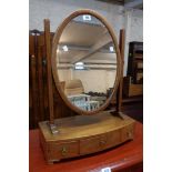 A 19 1/4" mahogany and strung platform dressing table mirror with oval plate and three drawers to