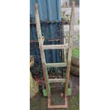 A vintage painted wood and iron sack truck