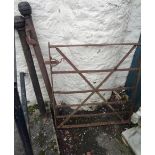 A metal strap gate and posts - gate width 3'