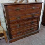 A 3' 4 1/4" Edwardian walnut chest of two short and three long graduated drawers set on moulded