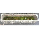 A concrete garden trough