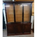 A 6' 4 1/4" late Victorian mahogany two part cabinet with moulded cornice and triple glazed bookcase