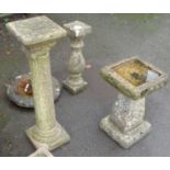 A concrete garden bird bath, another and an Ionic pattern garden pedestal