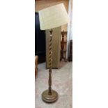 A polished oak barley twist standard lamp