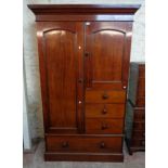 A 4' 3" Victorian mahogany wardrobe with moulded cornice, hanging space one side, further storage