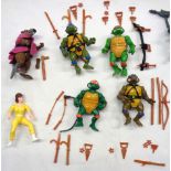 A collection of vintage 1988 Playmates Teenage Mutant Ninja Turtles figures, weapons and accessories