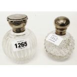 Two cut glass silver topped spherical scent bottles, one hobnail cut with screw cap, the other