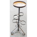 A 20th Century wrought iron multi tier plant pot stand