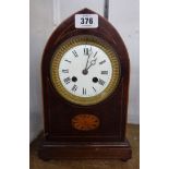 An Edwardian inlaid mahogany cased mitre shaped mantel clock with Marti bronze medal eight day