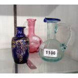 A small blue glass bottle with Neoclassical gilt overlay - sold with two coloured glass jugs