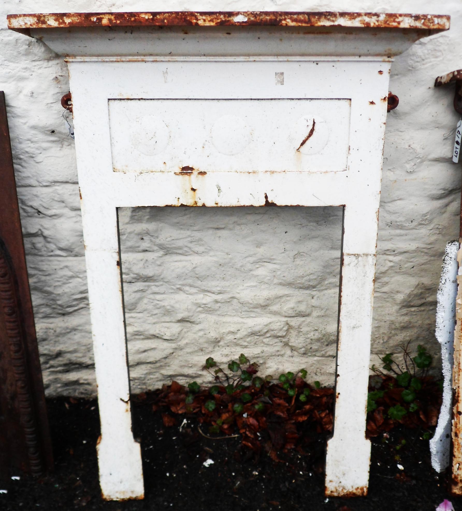 A Victorian cast iron bedroom fire surround