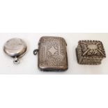 A silver vesta case with engraved decoration - Birmingham 1902 - sold with an embossed silver pill