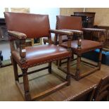 A set of eight early 20th Century antiqued oak framed panel back dining chairs with studded brown