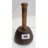 An old turned wood stone mason's mallet