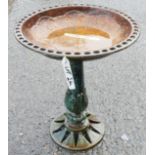 A cast iron bird bath