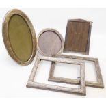Five assorted silver fronted photograph frames, including a pair of oblong - various condition