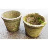 A pair of concrete garden pots