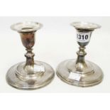 A pair of 4 1/2" solid silver squat candlesticks with detachable nozzles and wide circular bases -