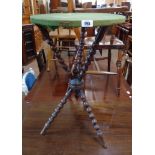 A 16 1/2" diameter late Victorian stained wood cricket table, set on typical bobbin turned supports