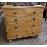 A 3' 4" Victorian waxed pine chest of two short and three long graduated drawers set on turned feet