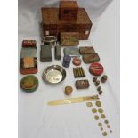 A Victorian Tunbridge ware box containing a cloissoné pot, various old tins, Avery weights, faux