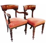 A set of eight William IV mahogany framed dining chairs with wide curved back rails, decorative