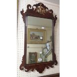 A late Georgian mahogany fretwork framed wall mirror with bird pierced pediment and replacement
