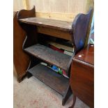 A 29 1/4" antique stained pine three shelf open bookcase with shaped standard ends