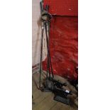 A large wrought iron companion set - sold with a pair of cast iron andirons