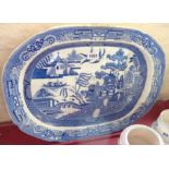 A Willow pattern meat plate with gravy well