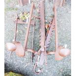 A wrought iron boot scraper, pair of jacks and pair of fire dogs