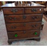 A 31 1/4" Georgian oak chest of two short and three long graduated drawers set on bracket feet