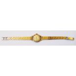 A hallmarked 9ct. gold Omega lady's wristwatch with seventeen jewel movement - Birmingham 1965 -