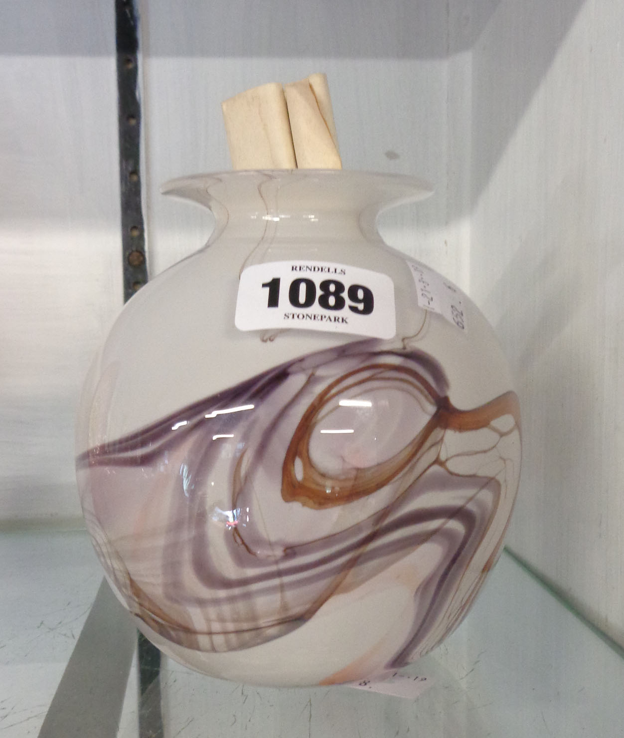 A glass vase of swirled marble design signed by Anthony Stern