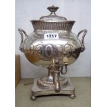A 12" antique silver plated copper samovar with flanking lion mask handles and platform base with