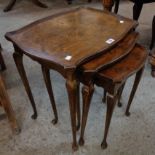 A nest of three walnut quarter veneered tea tables, set on slender legs with pad feet