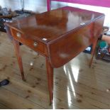 A 31 1/2" 19th Century mahogany Pembroke table with drawer to one end and opposing dummy drawer