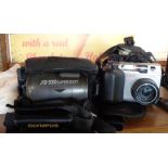 Two Olympus cameras in soft cases, a Camedia C-3000 and an AZ-330