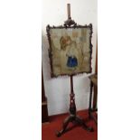 A 19th Century mahogany pole screen with original needlework panel under glass set on tulip